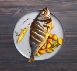 Морской окунь, запеченный в духовке с картофелем